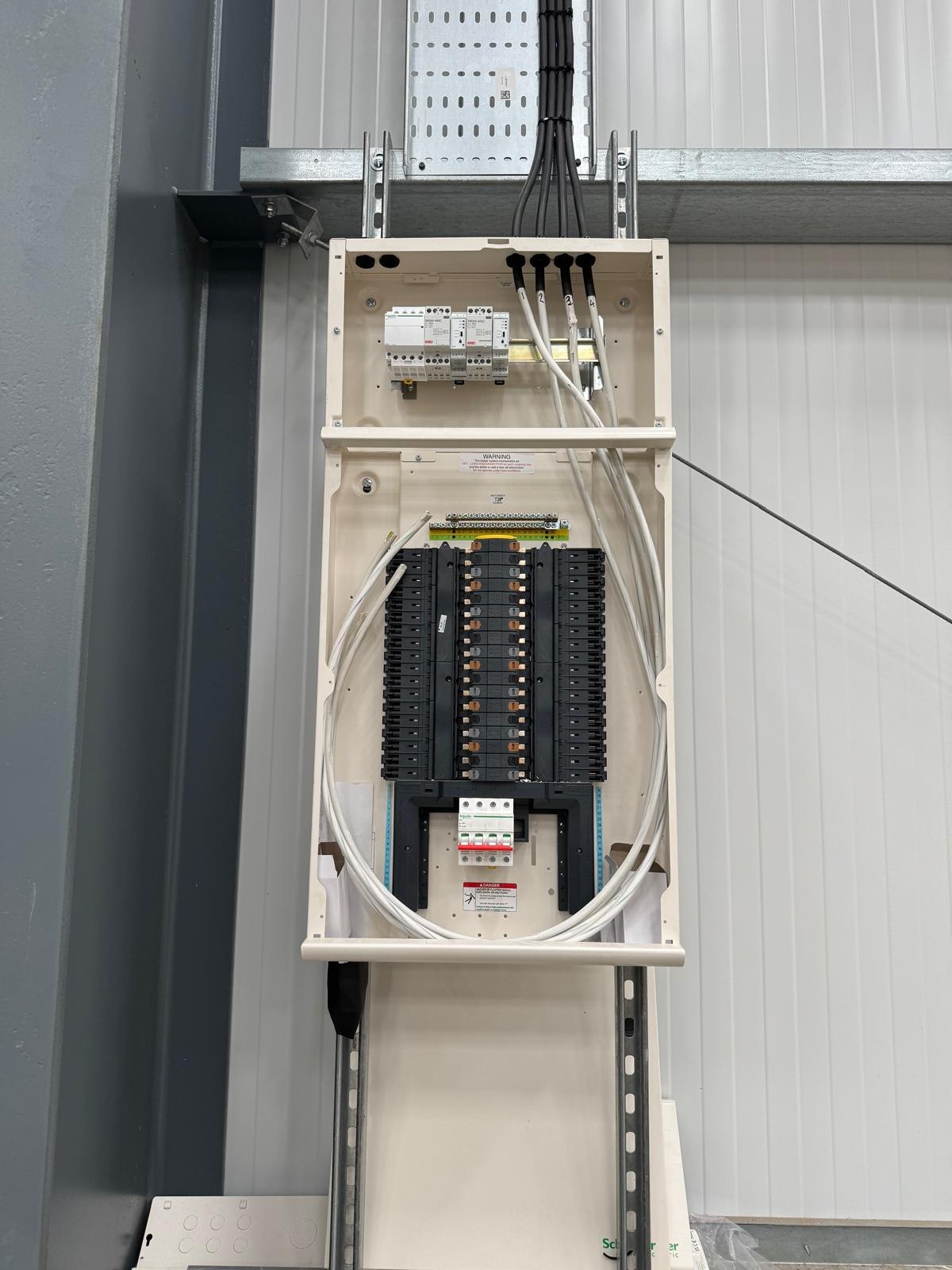 Electrical Installation: newly installed distribution board with circuit breakers and labelled cabling